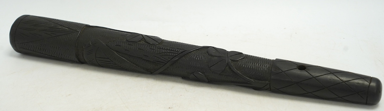 A late 19th/early 20th century Irish bog oak truncheon, carved with a harp and clovers, 37cm in length. Condition - good